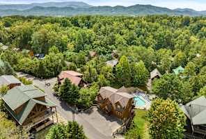Spacious mountain cabin rental with easy, large parking area accommodating 6+ cars, surrounded by scenic nature views—ideal for group getaways in Pigeon Forge downtown and near Gatlinburg and the Smoky Mountains National Park.
