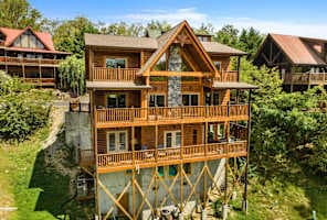 Luxury log cabin rental near downtown Pigeon Forge, offering multi-level decks, stunning mountain views, and proximity to top attractions—perfect for family vacations or group getaways in the Smoky Mountains.