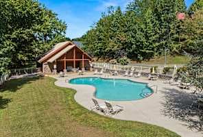 Enjoy access to a beautiful community pool, just a short walk from the cabin! Perfect for a refreshing swim on warm days, this family-friendly pool area offers plenty of seating and a relaxing atmosphere. A great spot to unwind and soak the sunshine.