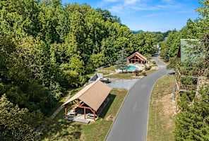 Enjoy access to a community pool and covered pavilion, just a short walk from the cabin! Perfect for summer swims, picnics, and gatherings, this serene spot offers a great way to relax & unwind while staying close to nature. Great amenity for guests.