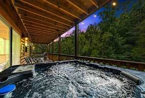 Relax in a private hot tub for up to 5 guests, surrounded by stunning forest views on a covered deck. Soak under the stars or unwind after a day of adventure. Perfect for romantic getaways, group trips and cozy retreats. Mountain serenity at its best