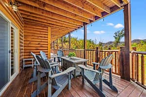 "Relax on the deck with a second outdoor fire pit, perfect for cozy evenings and stunning mountain views. Gather around the warmth with friends and family while enjoying the fresh air and peaceful surroundings. A perfect spot to unwind!