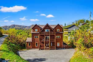 Spacious cabin retreat in Gatlinburg with stunning mountain views and plenty of parking. Enjoy multiple balconies, cozy interiors, & a peaceful setting just minutes from downtown attractions, dining, and entertainment. Perfect for a relaxing getaway!