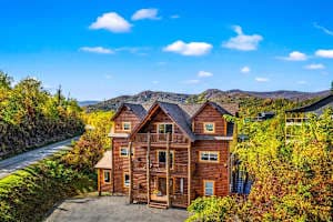 Spacious cabin retreat in Gatlinburg with stunning mountain views and plenty of parking. Enjoy multiple balconies, cozy interiors, & a peaceful setting just minutes from downtown attractions, dining, and entertainment. Perfect for a relaxing getaway!