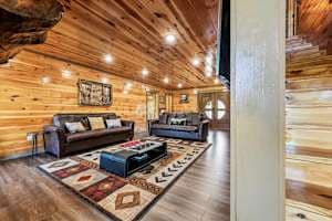 Cozy movie theater room with two sofa beds, a large TV, and a warm fireplace. Perfect for family movie nights or relaxing after a day of exploring. Enjoy ultimate comfort with beautiful views right from your seat!