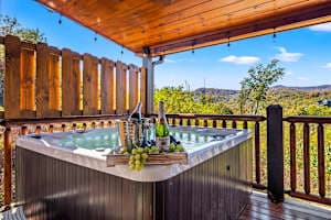 Relax in a private hot tub with stunning mountain views! Unwind under the covered deck, surrounded by nature, and soak in the peaceful Smoky Mountain atmosphere. The perfect spot for a romantic evening or a refreshing break after a day of adventure!
