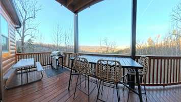 Fire up the propane grill and enjoy outdoor dining with a beautiful wooded view! This deck features a picnic table for group meals, making it perfect for family barbecues and gatherings. Relax, cook, & savor the fresh mountain air in this cozy space.