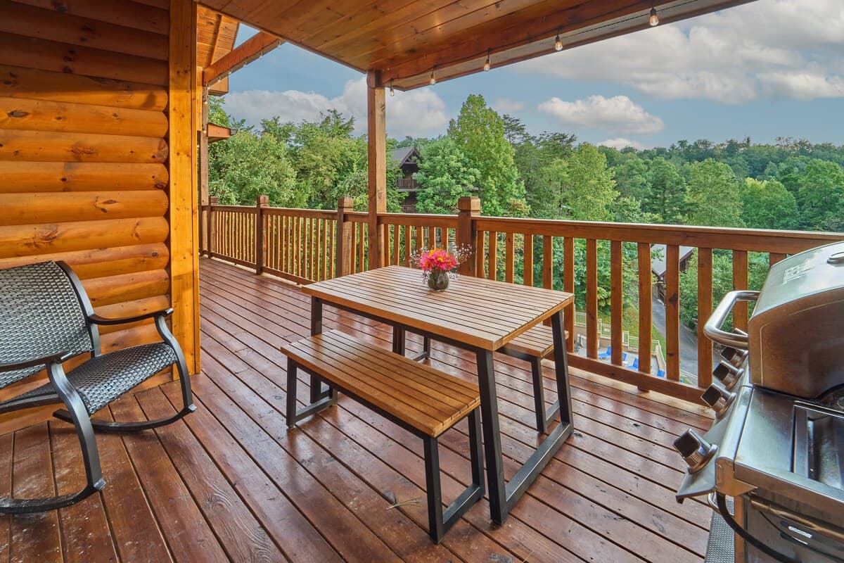 Fire up the propane grill and enjoy outdoor dining with a beautiful wooded view! This deck features a picnic table for group meals, making it perfect for family barbecues and gatherings. Relax, cook, & savor the fresh mountain air in this cozy space.