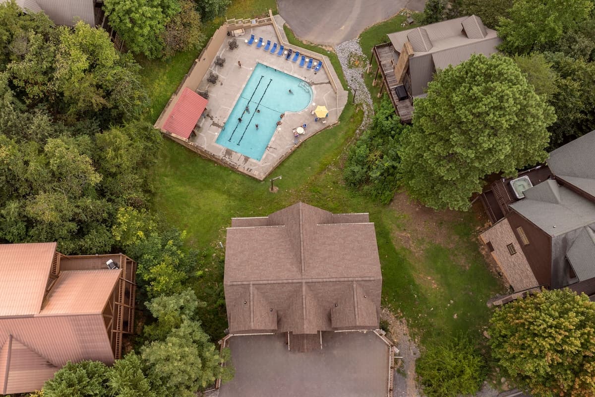 The community pool is conveniently located right in the backyard, offering a private feel with easy access. Perfect for a refreshing swim or lounging poolside, this amenity adds to the ultimate vacation experience. Relax, unwind, and enjoy the sun!