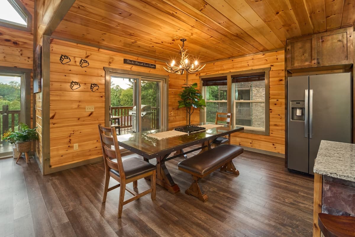 Gather around the spacious dining table for 8, with additional seating for 6 at the kitchen island. Perfect for family meals and group gatherings, this inviting space combines rustic charm with comfort, creating the ideal setting for shared moments!