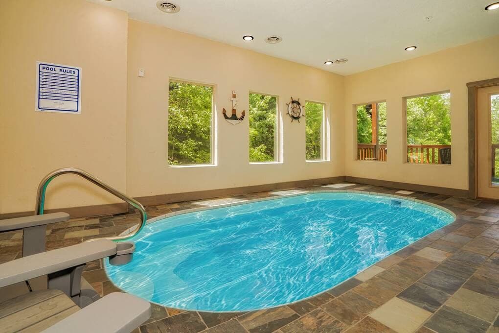 Enjoy a private indoor heated pool, perfect for year-round relaxation! This climate-controlled space offers ultimate comfort, whether you're unwinding after a day of adventure or having fun with family and friends. A luxurious feature for all seasons