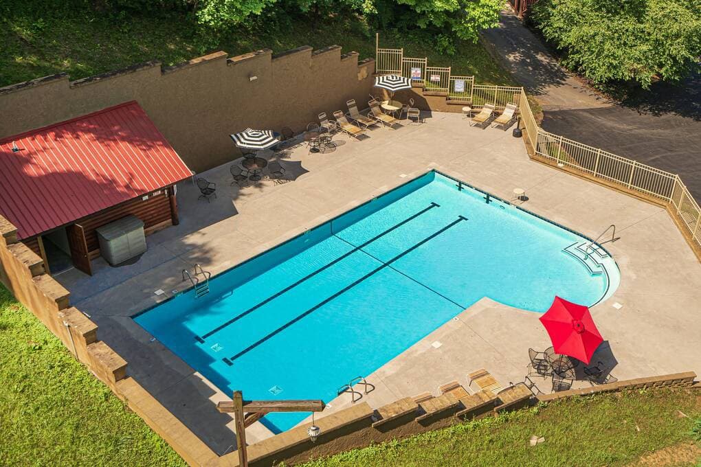 Enjoy the community pool located right in the backyard, offering the perfect place to cool off and relax. With plenty of seating and shaded areas, it’s ideal for families and friends looking to unwind just steps from the cabin.