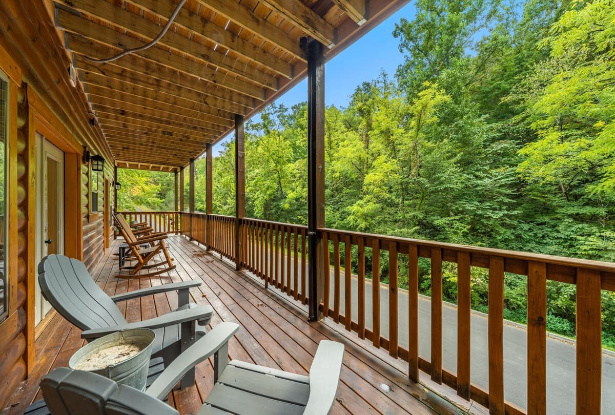 Enjoy the peaceful mountain setting from the covered deck, complete with classic rocking chairs and scenic views. Perfect for sipping coffee in the morning or unwinding in the evening, this cozy outdoor space offers relaxation surrounded by nature!
