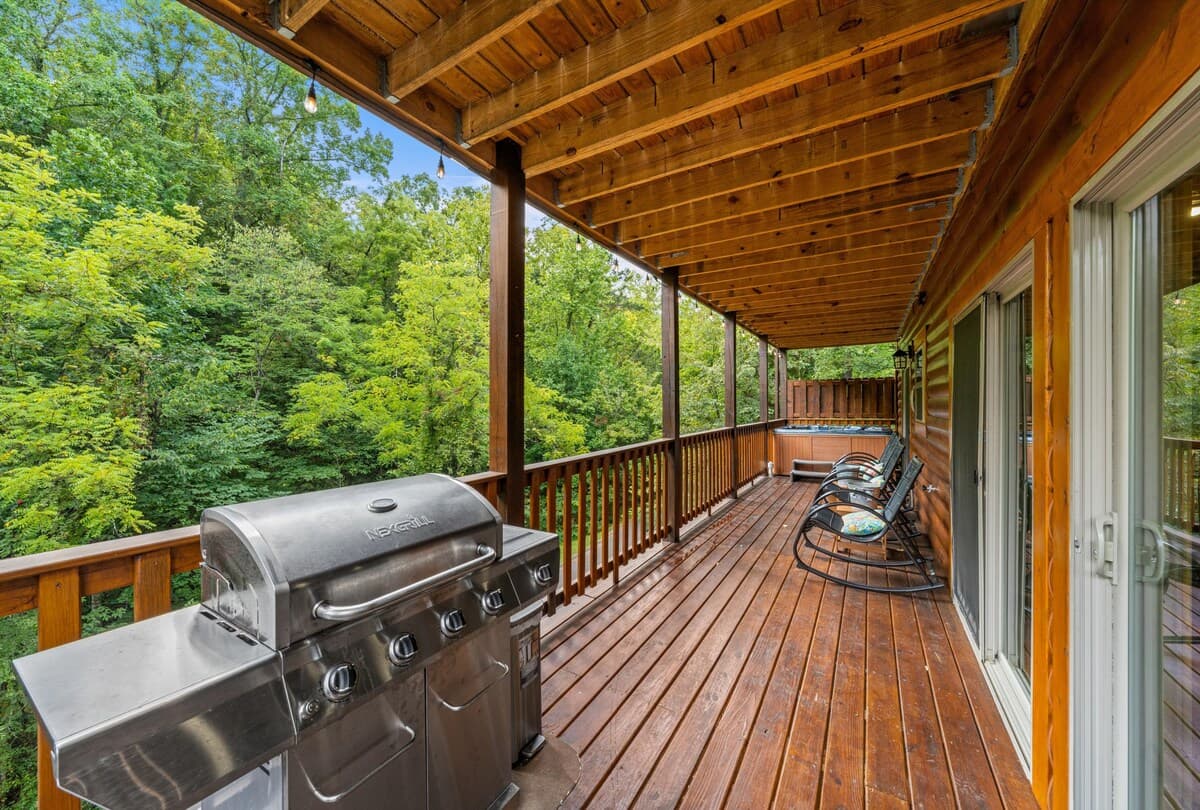 Fire up the propane grill and enjoy outdoor dining with a beautiful wooded view! This deck features a picnic table for group meals, making it perfect for family barbecues and gatherings. Relax, cook, & savor the fresh mountain air in this cozy space.